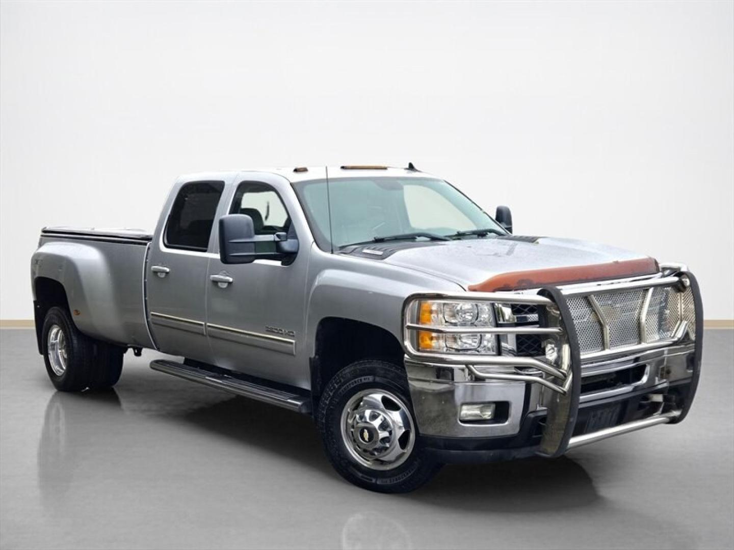 2013 Silver Ice Metallic Chevrolet Silverado 3500 LTZ (1GC4K1C84DF) with an Duramax 6.6L Diesel Turbo V8 397hp 765ft. lbs. engine, Automatic transmission, located at 25355 Eames Street, Channahon, IL, 60410, (815) 467-1807, 41.429108, -88.228432 - Unleash raw power and relentless performance with the 2013 Chevrolet Silverado 3500 LTZ, a true beast built to dominate any challenge. Under the hood roars the legendary Duramax 6.6L Diesel Turbo V8, delivering an unstoppable 397 horsepower and a massive 765 ft-lbs of torque. This isnt just a trucki- Photo#1